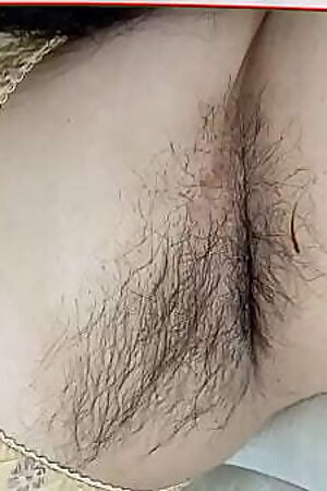 beautiful lady laying on bed in red penty with beautiful natural big tits